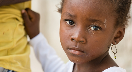 Child Holding Onto Someone